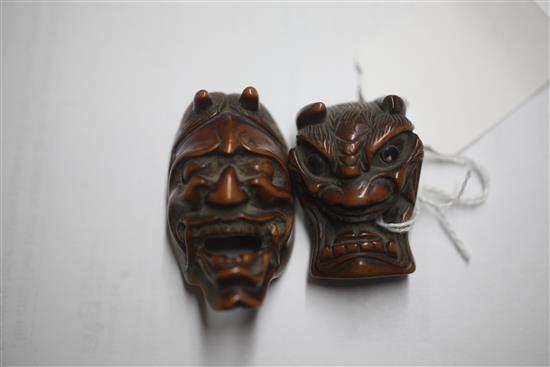 A Japanese Meiji carved wood Noh mask netsuke of Hannya and another similar